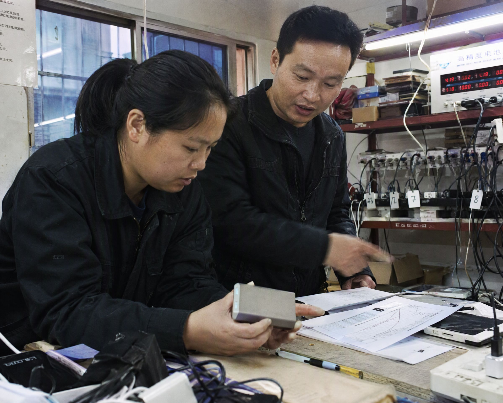 Inspection team reviewing battery test evidence